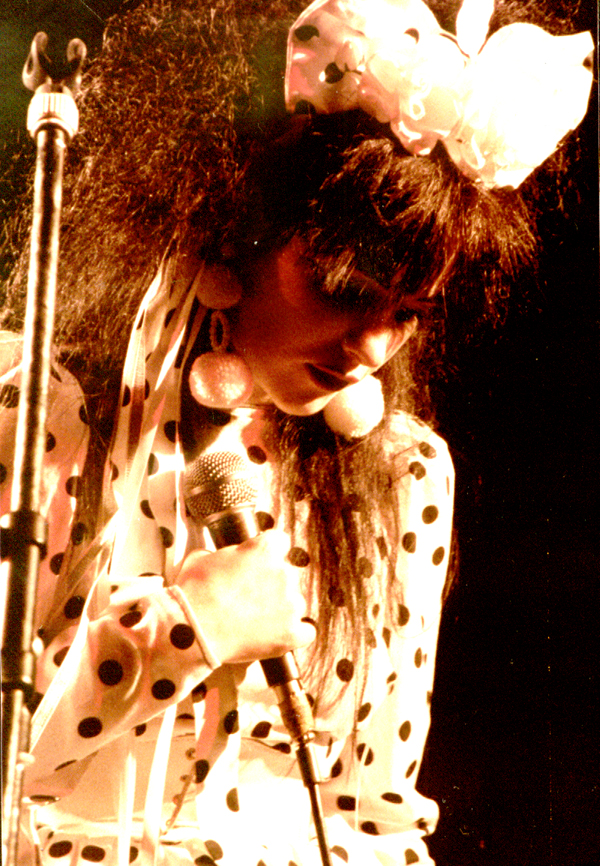 Rose on stage at The Warehouse, Leeds, supporting Orange Juice, 1 December 1982. Pic used by kind permission of Peter Anthony McArthur, who retains copyright.